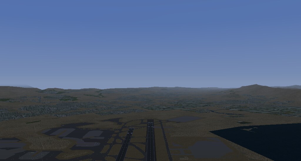 The same view with terrain: hills to the horizon, urban ground
       textures, the bay, and KSFO in the foreground.