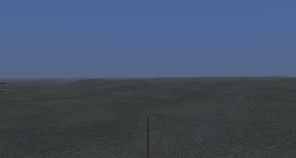 FlightGear over a Namibian airstrip: a single runway on flat ground,
low hills on the horizon, and a uniform surface with no variation in it.