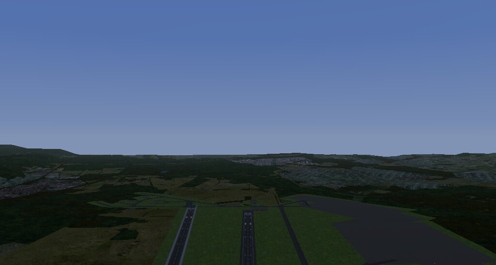 FlightGear over Ramstein air base: two parallel runways and a large
       apron, farmland and forest beyond, wooded hills on the horizon.